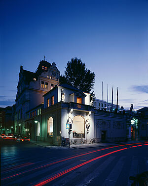 Münchner Künstlerhaus at early night under blue sky